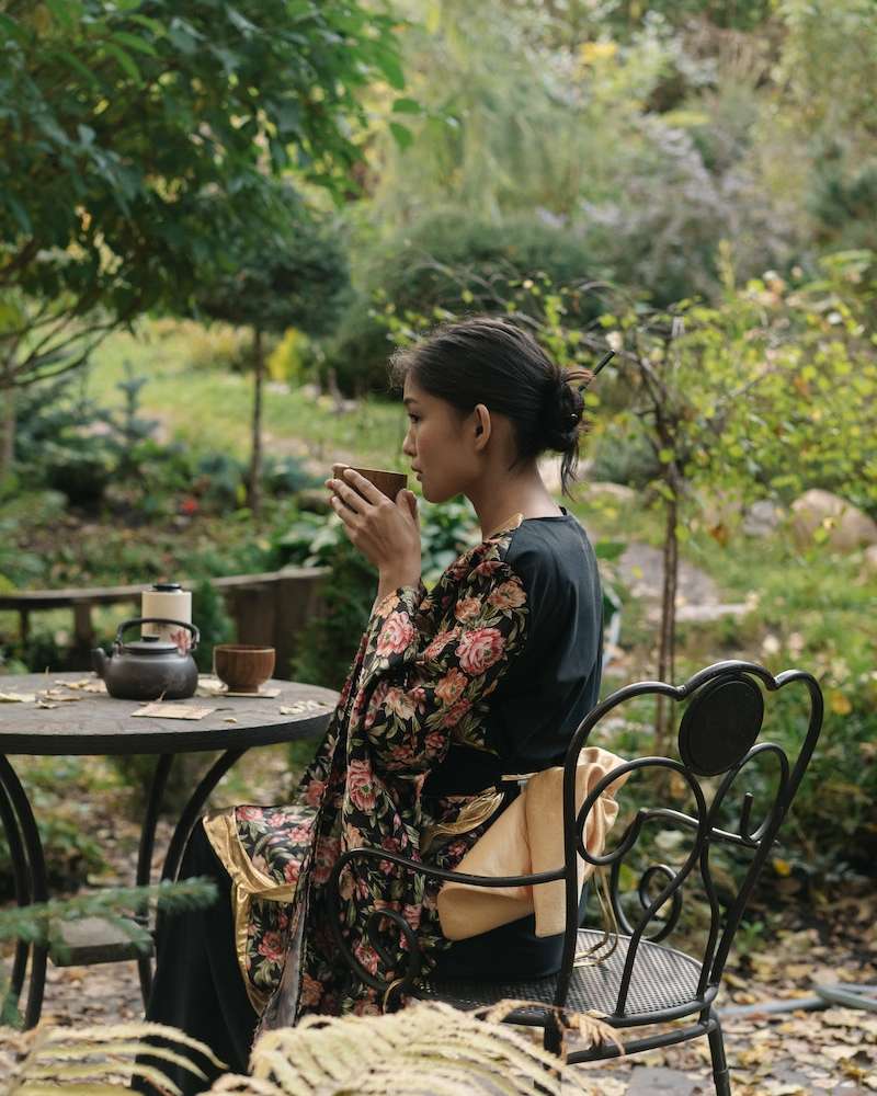 A Woman Drinking a Tea