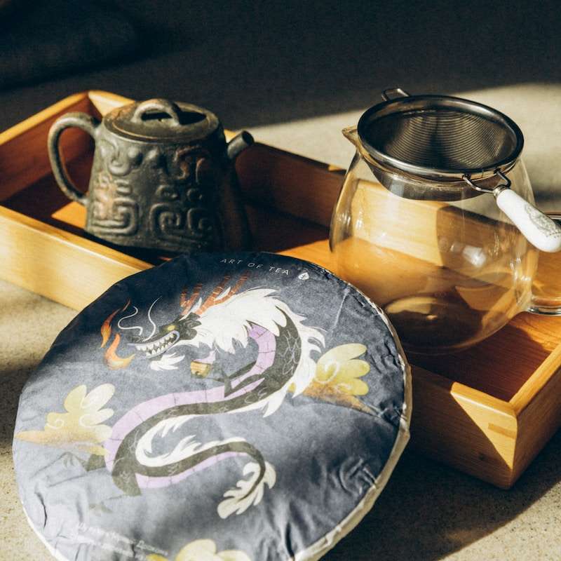 a tea pot and a tea tray on a table